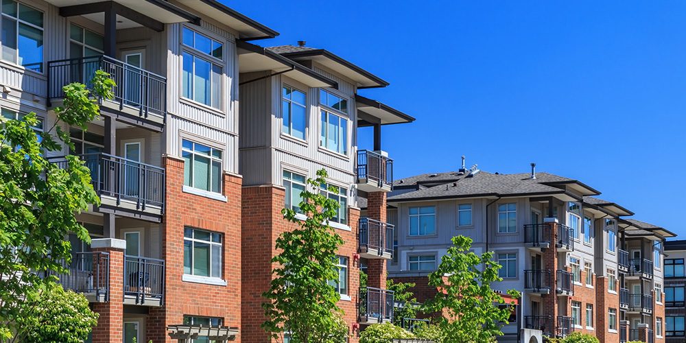 Modern three‑storey apartment building - https://www.rogersvilleins.com/